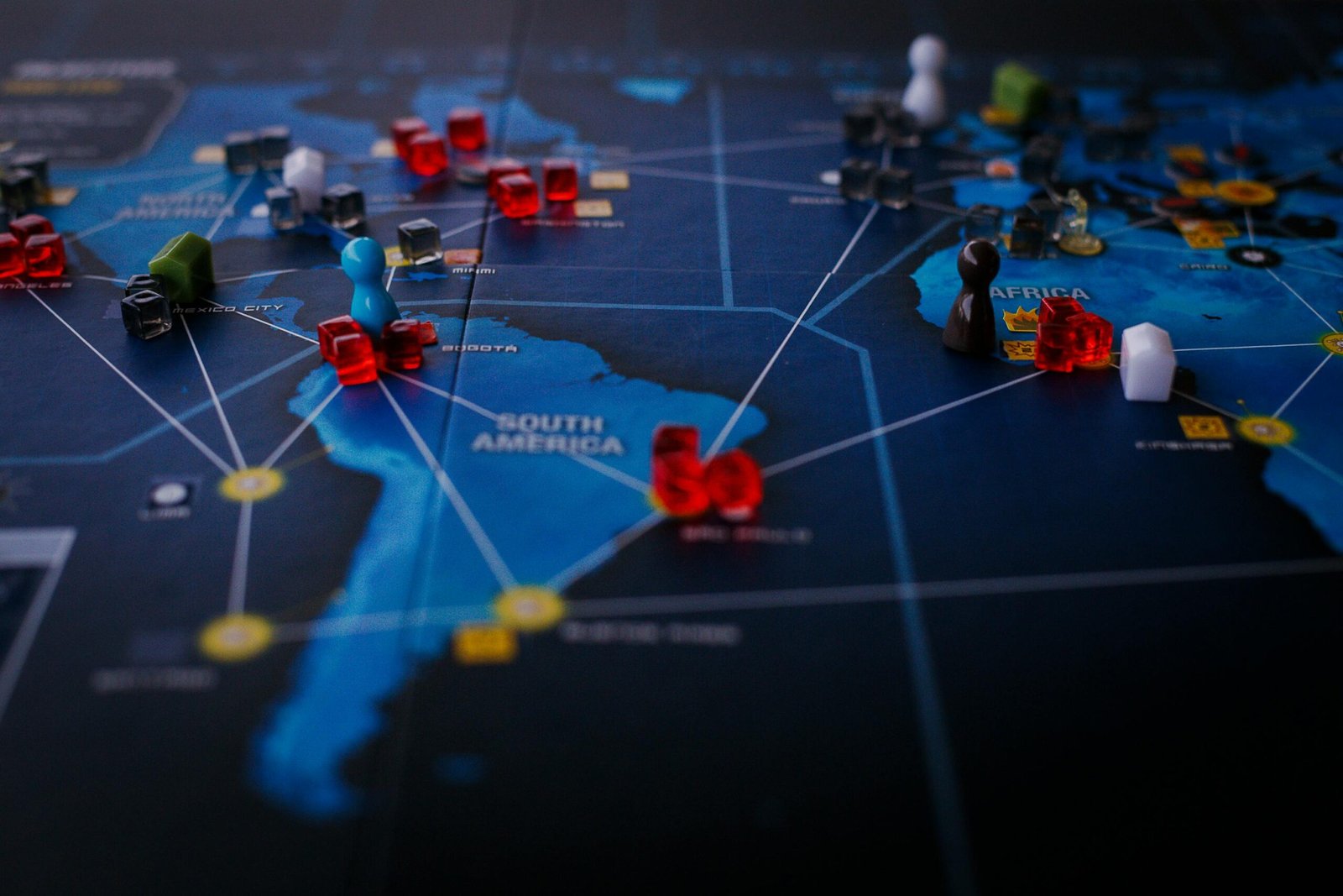 A strategic board game featuring a world map and colorful playing pieces.